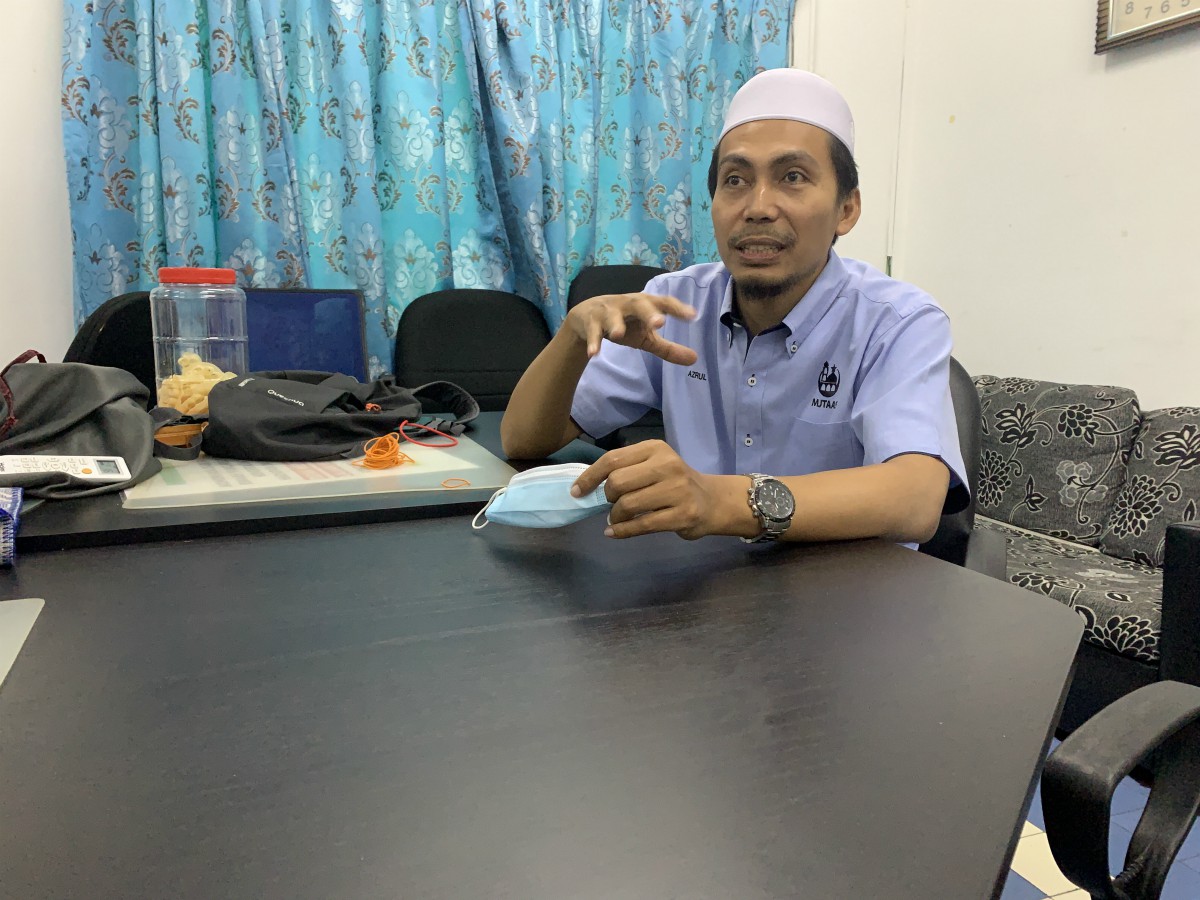 Azrul Azli bin Abdul Aziz Khatib, an imam at Masjid Jamek Tengku Abdul Aziz Shah, which serves the urban village of Kampung Penchala just outside Kuala Lumpur.